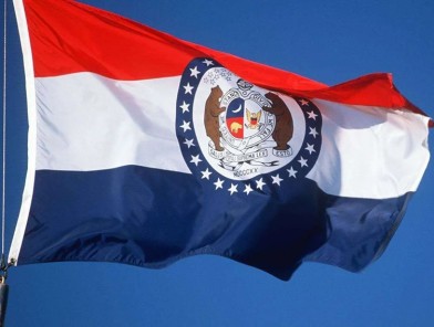 The official state flag of Missouri waving in the wind.